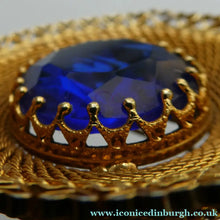 Load image into Gallery viewer, Vintage Costume Brooch with Heart Shapes on Rim and Blue Faceted Glass Insert
