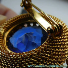 Load image into Gallery viewer, Vintage Costume Brooch with Heart Shapes on Rim and Blue Faceted Glass Insert
