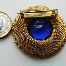 Load image into Gallery viewer, Vintage Costume Brooch with Heart Shapes on Rim and Blue Faceted Glass Insert
