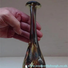 Load image into Gallery viewer, A tall, attenuated Mdina glass bottle vase with a tortoiseshell pattern and silvery trail decorations.
