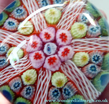 Load image into Gallery viewer, Collectable 1970s Scottish Glass Paperweight with 7 Spokes. Unusual Red Ground and Tutti Frutti Colours - Paperweight
