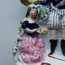Load image into Gallery viewer, Rarer ANTIQUE Staffordshire Figurine / Spill Vase Featuring a Man and Woman with Dog Standing Beside a Tree
