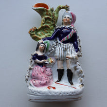 Load image into Gallery viewer, Rarer ANTIQUE Staffordshire Figurine / Spill Vase Featuring a Man and Woman with Dog Standing Beside a Tree
