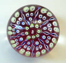 Load image into Gallery viewer, Vintage JOHN DEACONS Paperweight Cranberry Glass Ground, Millefiori Canes &amp; Nine Half Spokes. StK Cane
