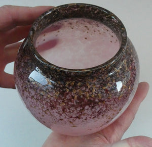SCOTTISH GLASS. MONART Scottish Art Glass Vase. Bulbous Shape (A). Mottled Dusky Warm Pink with Black Flecks & Gold Aventurine at the Rim. 5 1/2 inches high