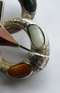 1880s SCOTTISH SILVER: Victorian Quatrefoil Shape and Raised Star Brooch with Inset Specimen Agates