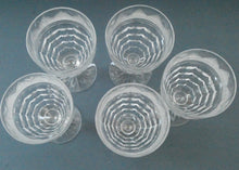 Load image into Gallery viewer, 1930s ART DECO Stuart Crystal FIVE Wine Glasses. With Cut Oval Facets and Engraved Fan Fringe Pattern. Height 4 1/2 inches
