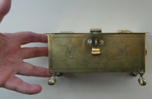 Load image into Gallery viewer, Arts and Crafts Brass Casket with Engraved Wyvern Decoration, Strapwork Bands &amp; Claw Feet
