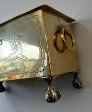 Load image into Gallery viewer, Arts and Crafts Brass Casket with Engraved Wyvern Decoration, Strapwork Bands &amp; Claw Feet
