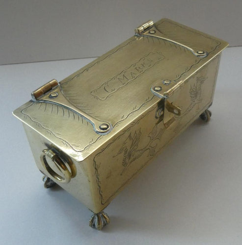 Arts and Crafts Brass Casket with Engraved Wyvern Decoration, Strapwork Bands & Claw Feet