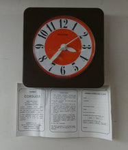 Load image into Gallery viewer, Made in Ireland Wall Clock Hanson or Hansco. Vintage Orange and Brown Plastic
