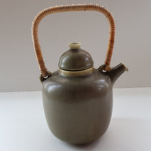Load image into Gallery viewer, Highly Collectable 1960s DANISH ART POTTERY. Teapot with Wicker Handle. Designed by Frode Blichfeldt Bahnsen for Palshus
