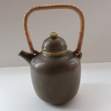 Load image into Gallery viewer, Highly Collectable 1960s DANISH ART POTTERY. Teapot with Wicker Handle. Designed by Frode Blichfeldt Bahnsen for Palshus
