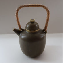 Load image into Gallery viewer, Highly Collectable 1960s DANISH ART POTTERY. Teapot with Wicker Handle. Designed by Frode Blichfeldt Bahnsen for Palshus
