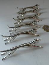 Load image into Gallery viewer, Collectable Vintage Set of SIX Silver Plate Knife Rests in the form of Running Dogs
