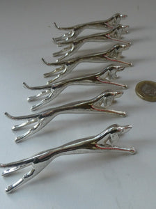 Collectable Vintage Set of SIX Silver Plate Knife Rests in the form of Running Dogs