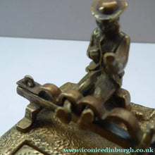 Load image into Gallery viewer, ANTIQUE INKWELL. An Extremely Rare Miniature Example Featuring a Little Man in Village Stocks Being Pelted with Fruit
