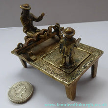 Load image into Gallery viewer, ANTIQUE INKWELL. An Extremely Rare Miniature Example Featuring a Little Man in Village Stocks Being Pelted with Fruit
