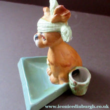 Load image into Gallery viewer, Bisque Porcelain Figure by Schafer &amp; Vater. Comical Dog Model Set Onto an Ashtray
