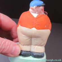 Load image into Gallery viewer, Porcelain Figure by Schafer &amp; Vater. Match Holder in the Form of a Man in an Orange Jacket: ON STRIKE
