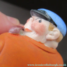 Load image into Gallery viewer, Porcelain Figure by Schafer &amp; Vater. Match Holder in the Form of a Man in an Orange Jacket: ON STRIKE
