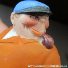 Load image into Gallery viewer, Porcelain Figure by Schafer &amp; Vater. Match Holder in the Form of a Man in an Orange Jacket: ON STRIKE
