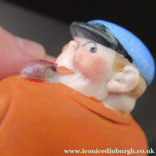 Load image into Gallery viewer, Porcelain Figure by Schafer &amp; Vater. Match Holder in the Form of a Man in an Orange Jacket: ON STRIKE
