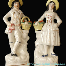 Load image into Gallery viewer, Victorian Staffordshire Figurines. Couple Harvesting and Carrying Baskets of Fruit
