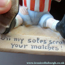 Load image into Gallery viewer, Antique Porcelain Match Holder &amp; Striker by Schafer &amp; Vater. FOOTBALLER HOLDING A FOOTBALL
