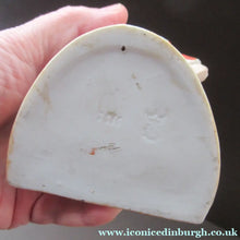 Load image into Gallery viewer, Antique Porcelain Match Holder &amp; Striker by Schafer &amp; Vater. FOOTBALLER HOLDING A FOOTBALL
