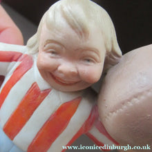 Load image into Gallery viewer, Antique Porcelain Match Holder &amp; Striker by Schafer &amp; Vater. FOOTBALLER HOLDING A FOOTBALL
