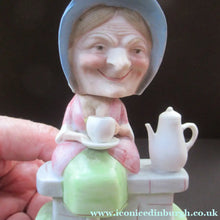 Load image into Gallery viewer, Antique Porcelain Nodder Figurine by Schafer &amp; Vater. Old Lady in Garden Drinking Tea 
