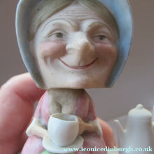 Load image into Gallery viewer, Antique Porcelain Nodder Figurine by Schafer &amp; Vater. Old Lady in Garden Drinking Tea 
