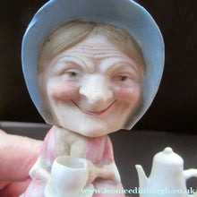 Load image into Gallery viewer, Antique Porcelain Nodder Figurine by Schafer &amp; Vater. Old Lady in Garden Drinking Tea 
