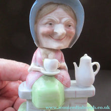 Load image into Gallery viewer, Antique Porcelain Nodder Figurine by Schafer &amp; Vater. Old Lady in Garden Drinking Tea 

