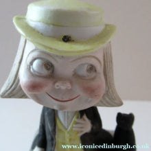 Load image into Gallery viewer, Antique Porcelain Nodder or Swinger Pin Tray by Schafer &amp; Vater. Boy Wearing Yellow Straw Hat with Black Cat
