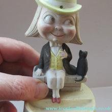Load image into Gallery viewer, Antique Porcelain Nodder or Swinger Pin Tray by Schafer &amp; Vater. Boy Wearing Yellow Straw Hat with Black Cat
