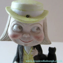 Load image into Gallery viewer, Antique Porcelain Nodder or Swinger Pin Tray by Schafer &amp; Vater. Boy Wearing Yellow Straw Hat with Black Cat
