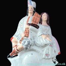 Load image into Gallery viewer, ANTIQUE Victorian Staffordshire Flatback Figurine. A Highlander and his Sweetheart Sitting on a Clock Face. Poor Man's Clock
