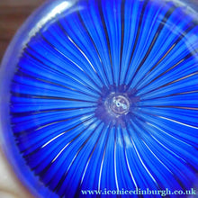 Load image into Gallery viewer, Scottish Paperweight by Peter McDougall Glass Studio. With Studio Cane on the Base with lilac lampwork flower 
