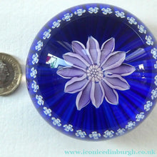 Load image into Gallery viewer, Scottish Paperweight by Peter McDougall Glass Studio. With Studio Cane on the Base with lilac lampwork flower 

