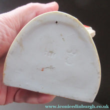 Load image into Gallery viewer, Antique Porcelain Match Holder &amp; Striker by Schafer &amp; Vater. FOOTBALLER HOLDING A FOOTBALL
