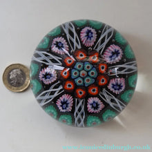 Load image into Gallery viewer, Fine VASART Scottish Glass Paperweight with 7 Short Spokes; with black ground, thick latticino spokes &amp; larger millefiori canes
