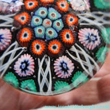 Load image into Gallery viewer, Fine VASART Scottish Glass Paperweight with 7 Short Spokes; with black ground, thick latticino spokes &amp; larger millefiori canes
