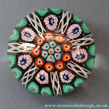 Load image into Gallery viewer, Fine VASART Scottish Glass Paperweight with 7 Short Spokes; with black ground, thick latticino spokes &amp; larger millefiori canes
