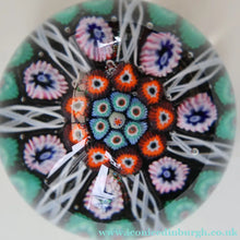 Load image into Gallery viewer, Fine VASART Scottish Glass Paperweight with 7 Short Spokes; with black ground, thick latticino spokes &amp; larger millefiori canes
