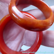 Load image into Gallery viewer, Set of Four Art Deco Bakelite Napkin Rings. Mostly Amber 1930s
