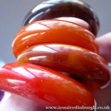 Load image into Gallery viewer, Set of Four Art Deco Bakelite Napkin Rings. Mostly Amber 1930s

