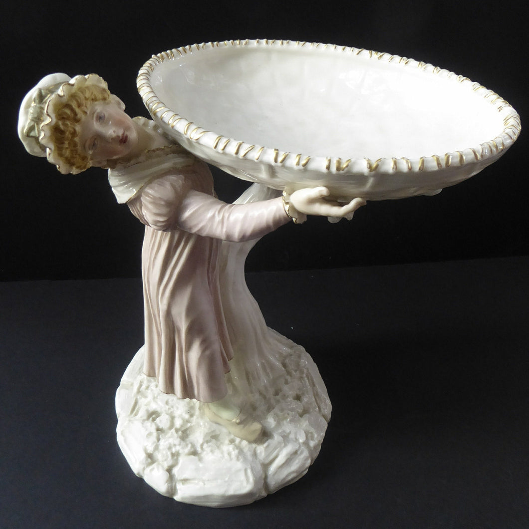 ROYAL WORCESTER James Hadley Figurine after Kate Greenaway. Lady Carrying a Large Wicket Basket