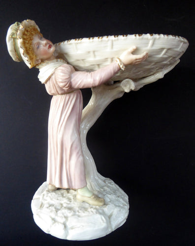 ROYAL WORCESTER James Hadley Figurine after Kate Greenaway. Lady Carrying a Large Wicket Basket